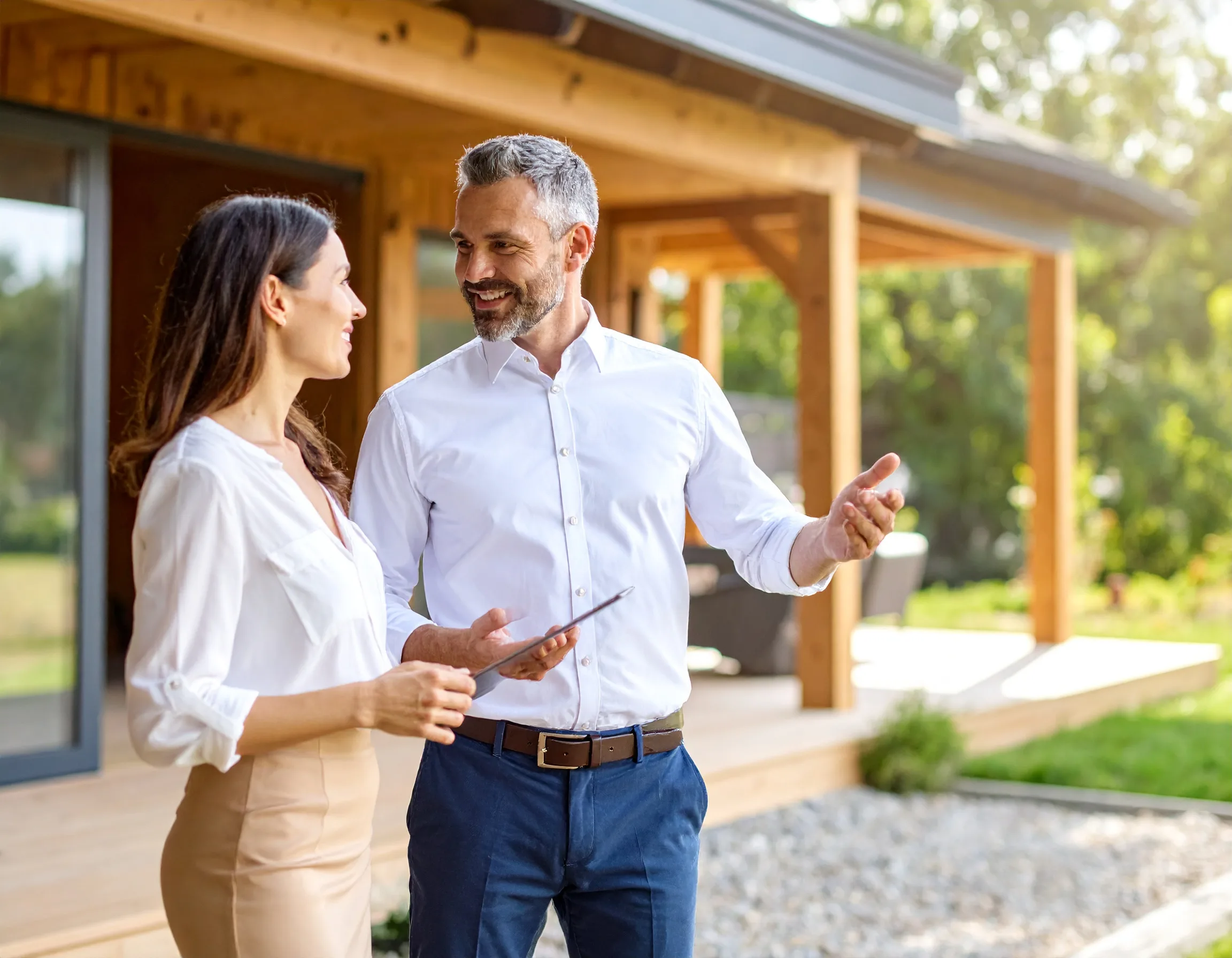 Design build remodeler presenting a project portfolio to homeowners