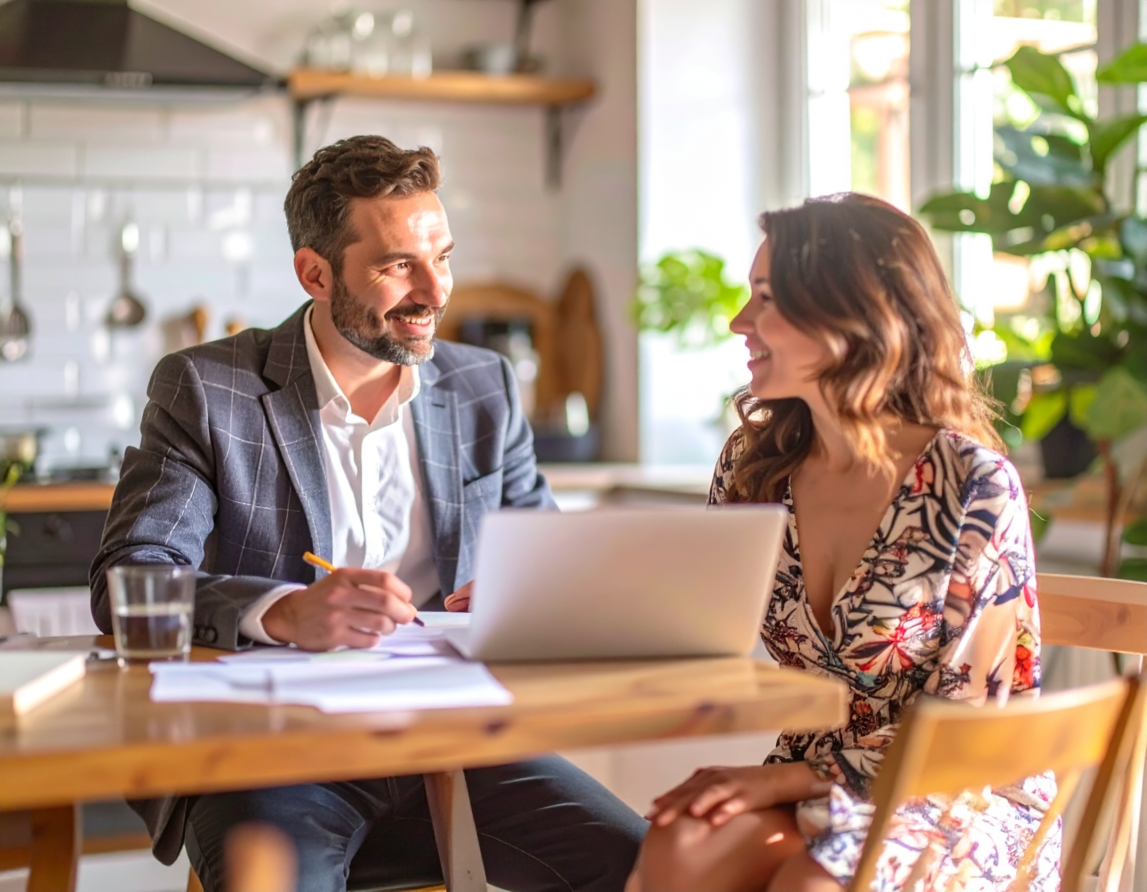 Contractor consulting with a homeowner over a laptop