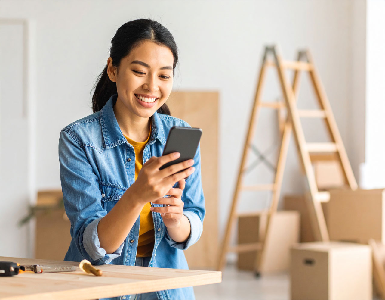 Homeowner searching on smartphone during a home renovation